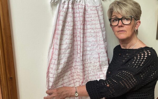 In Wales, an artist sews names of Gaza’s infant victims on christening gown