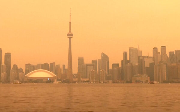 Wildfire smoke engulfs Toronto, Canada and turns its skies orange