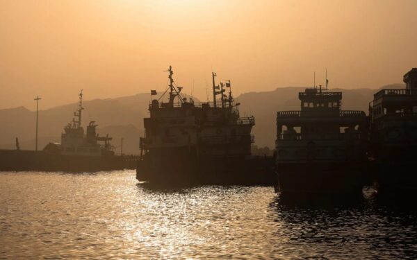 Iran and Oman work on temporary Hormuz shipping route as Trump threatens to claim the strait